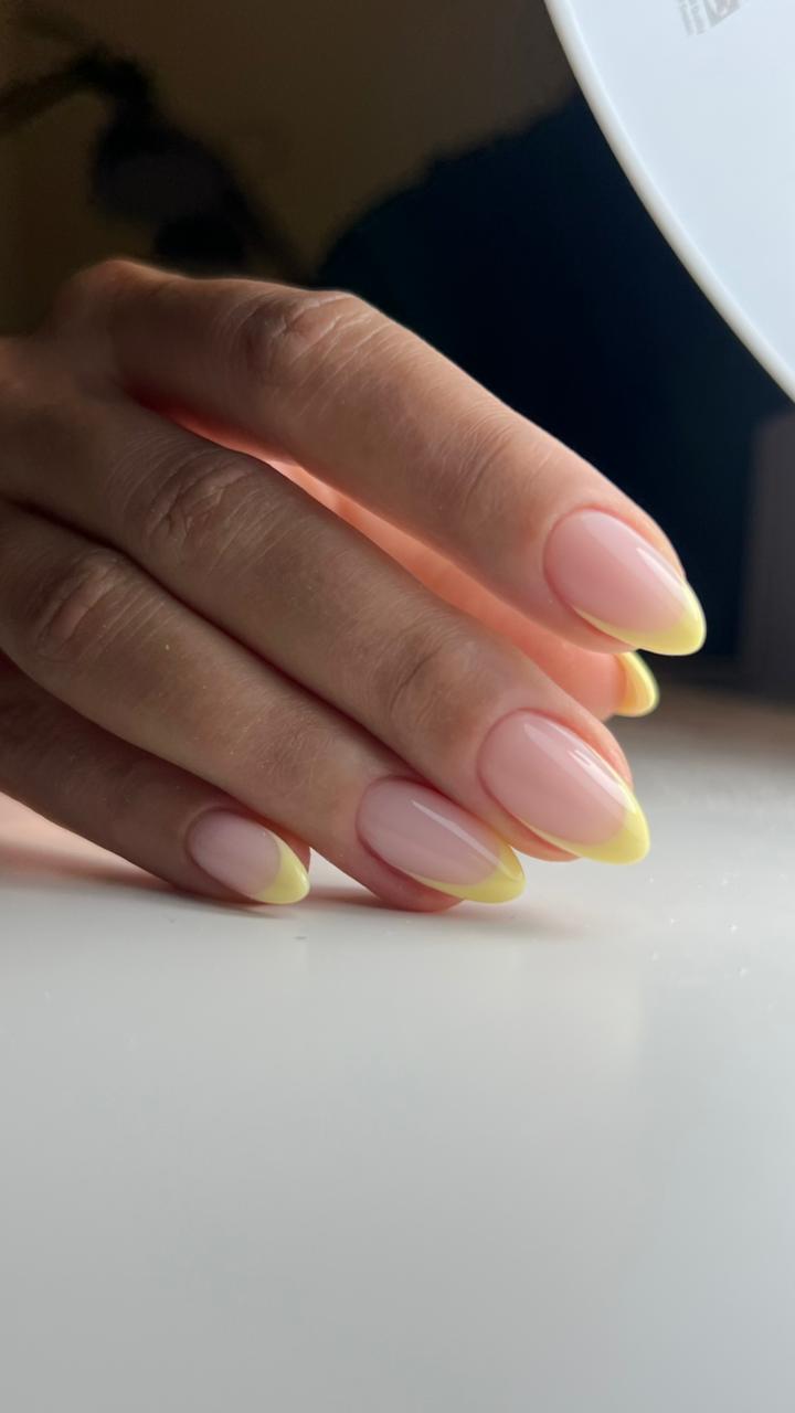 Pastel yellow French almond nails