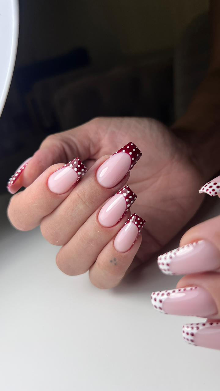 Pink ballerina nails with burgundy polka-dot French tips