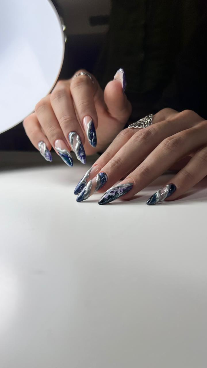 Blue and silver chrome marble stiletto nails