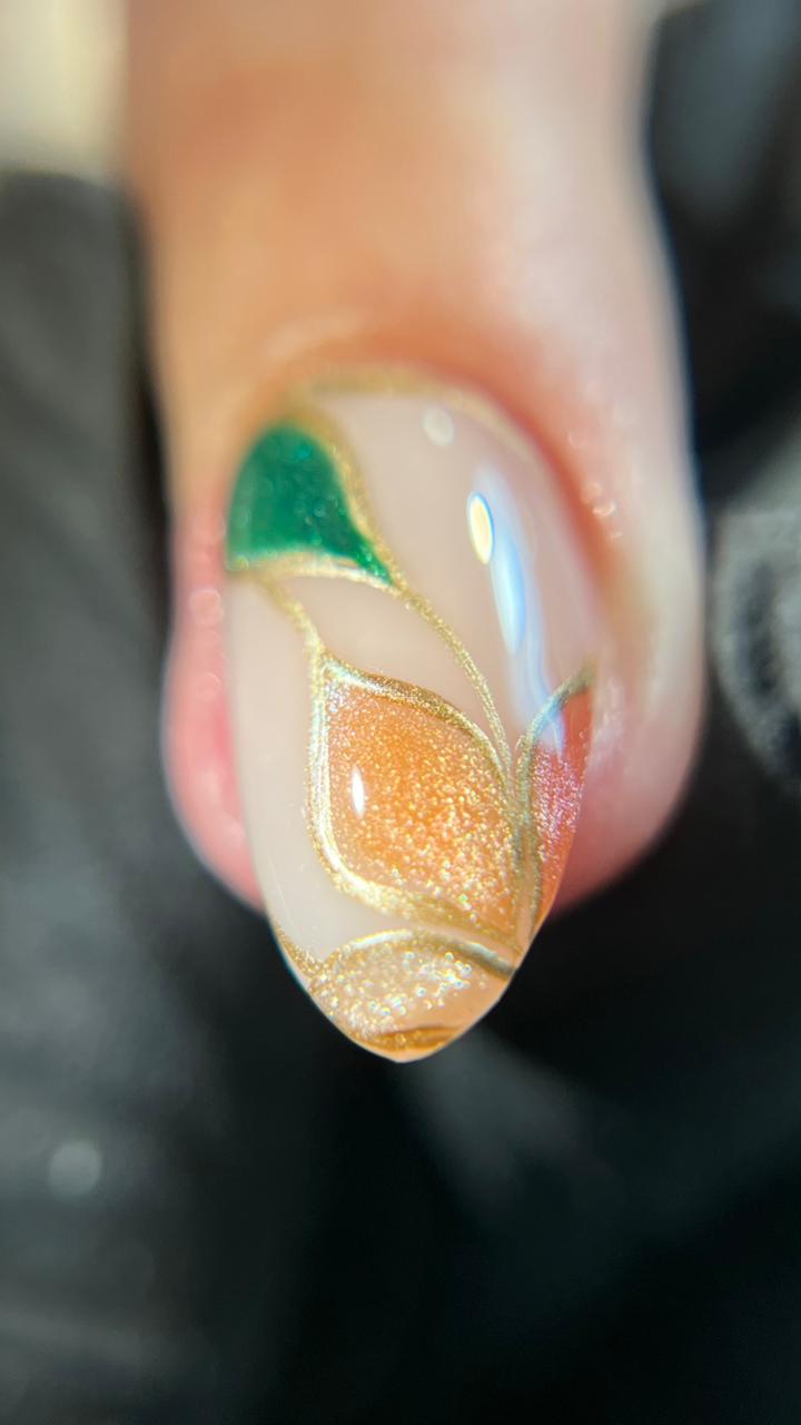 Nude nail with green and gold leaf art