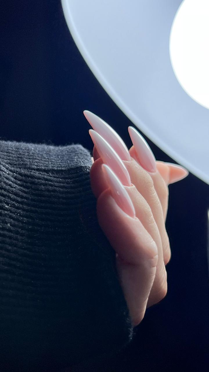 Long milky-nude stiletto nails