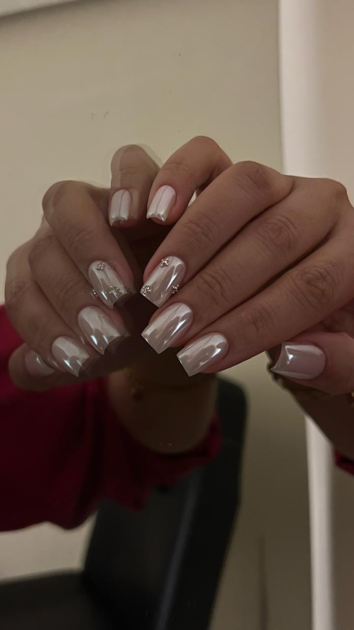 Pearl-white chrome square nails with crystal accents