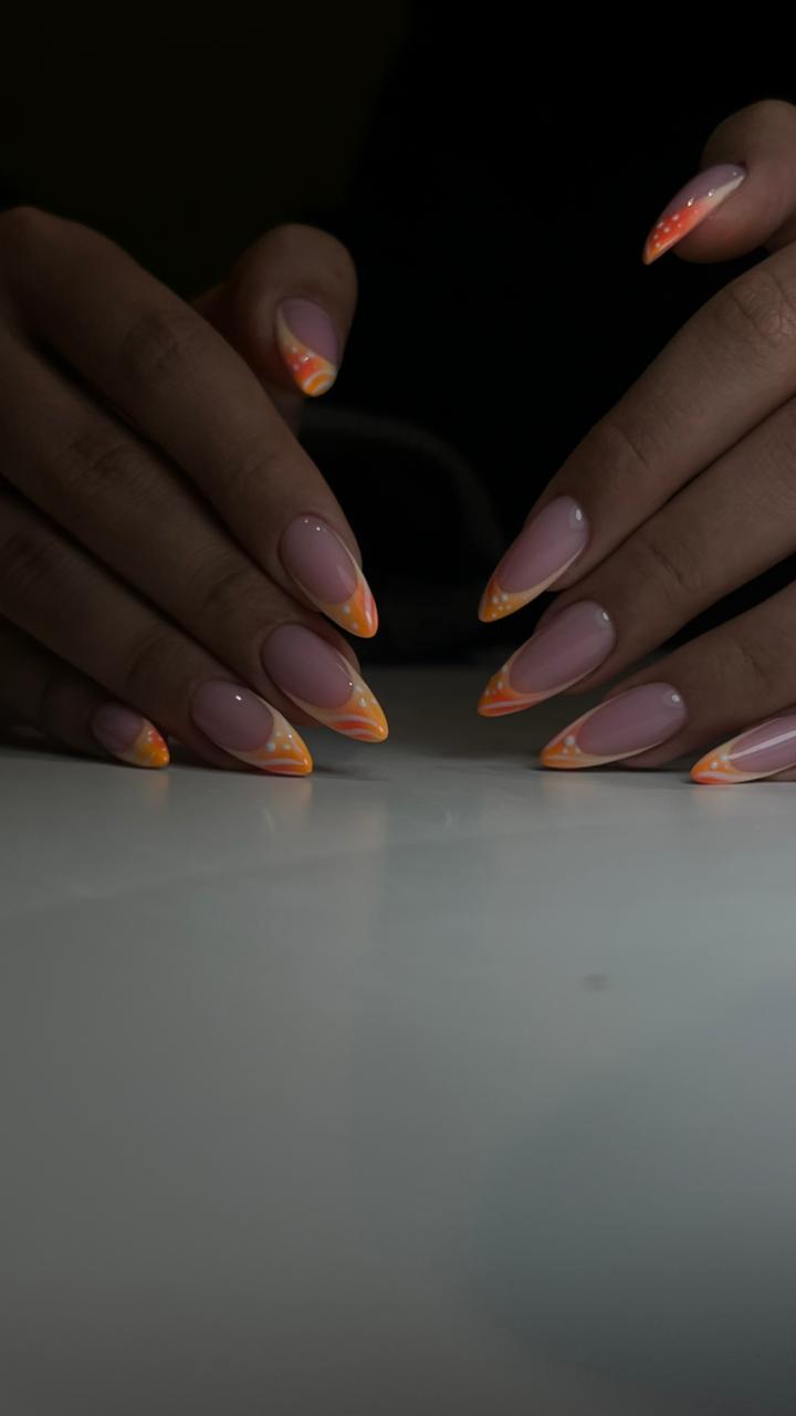 Peach and orange sunset French almond nails