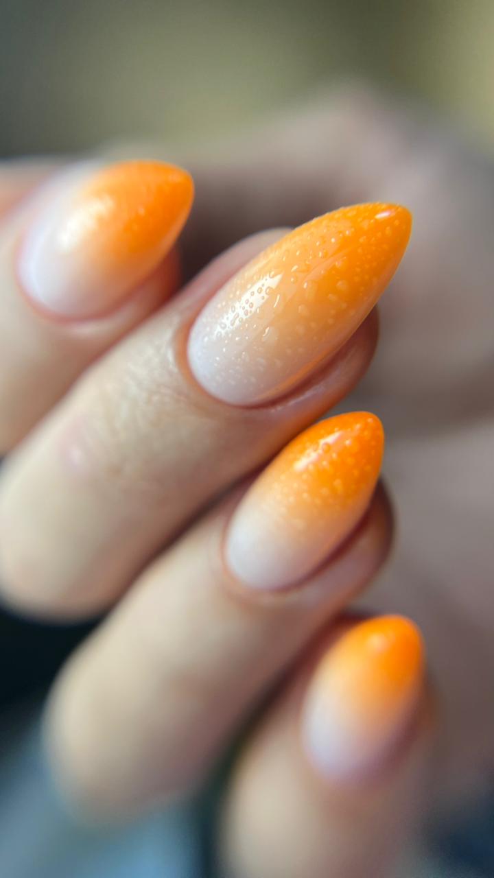 Tangerine almond nails with velvet sugar finish